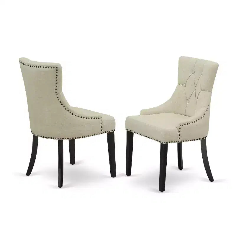 Ensemble de salle à manger HomeStock 5 pièces comprenant une table de salle à manger ronde avec rallonges et quatre chaises Parson avec tissu beige clair, finition noire.